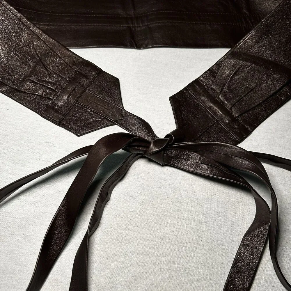 brown leather waist belt, featuring a wrap-around tie design
